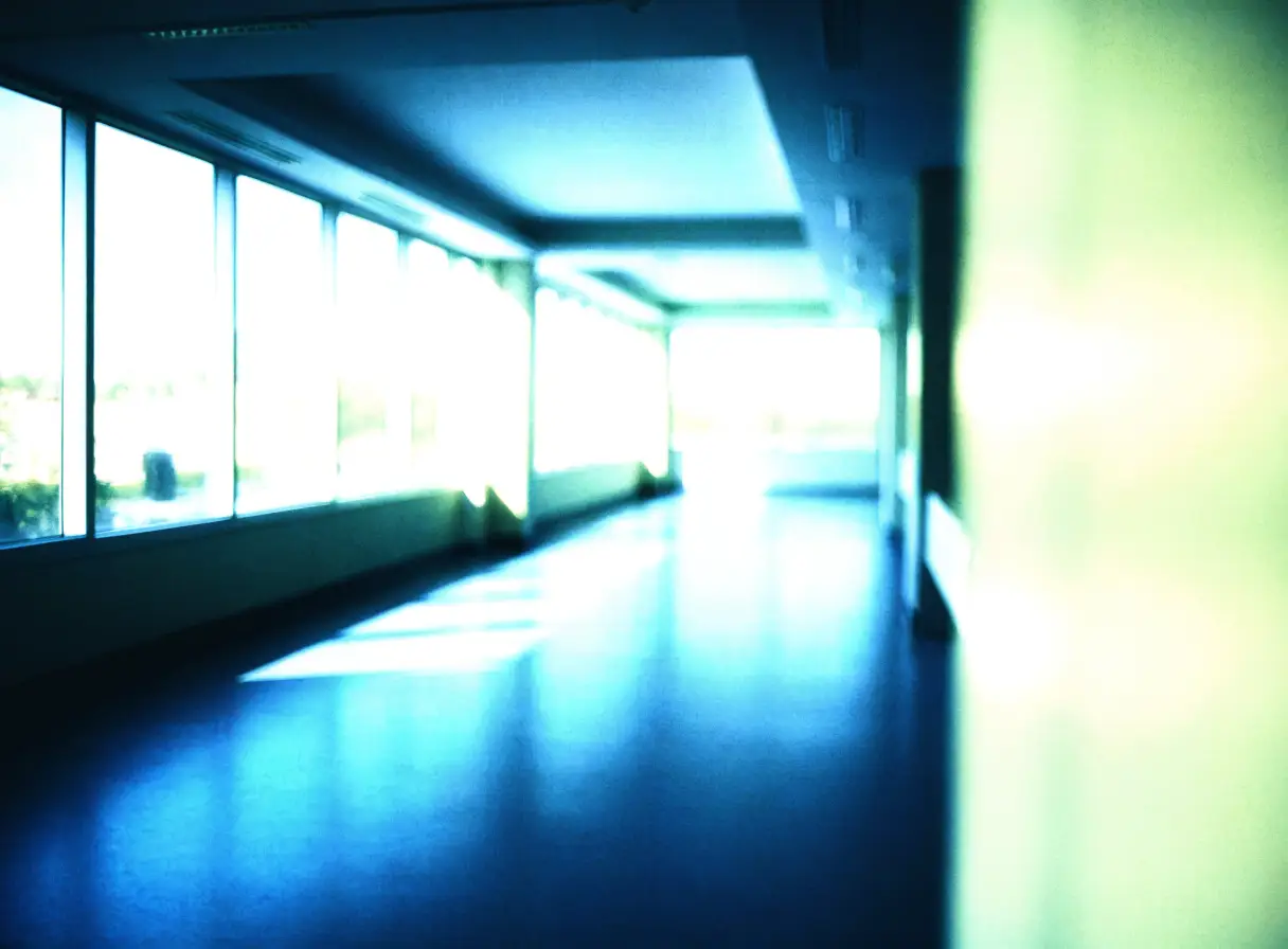 A calm, light-filled corridor inside a modern accredited Mumbai hospital